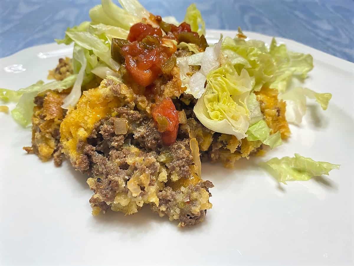 Serving Mexican Cornbread with Lettuce and Salsa