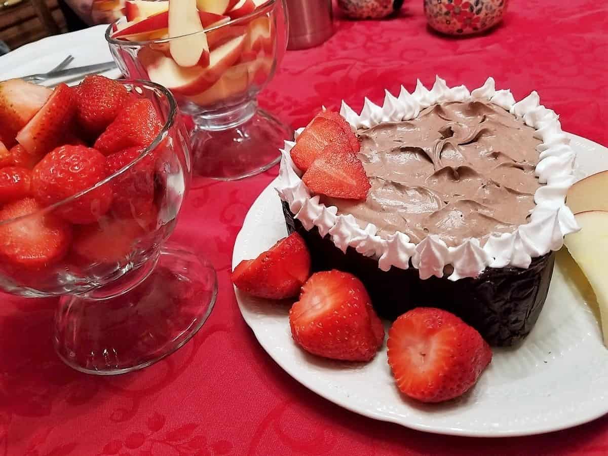 Serve Chocolate Mousse with Strawberries and Sliced Apples