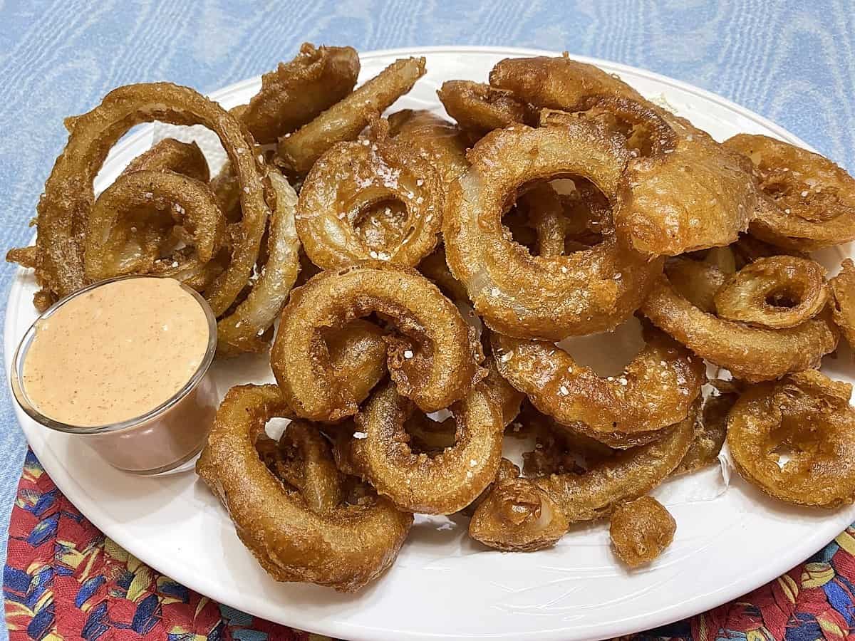 Serving Onion Rings on a Large Platter with Dipping Sauce