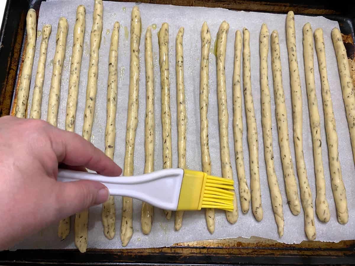 Spread Olive Oil Over Each of the Breadsticks