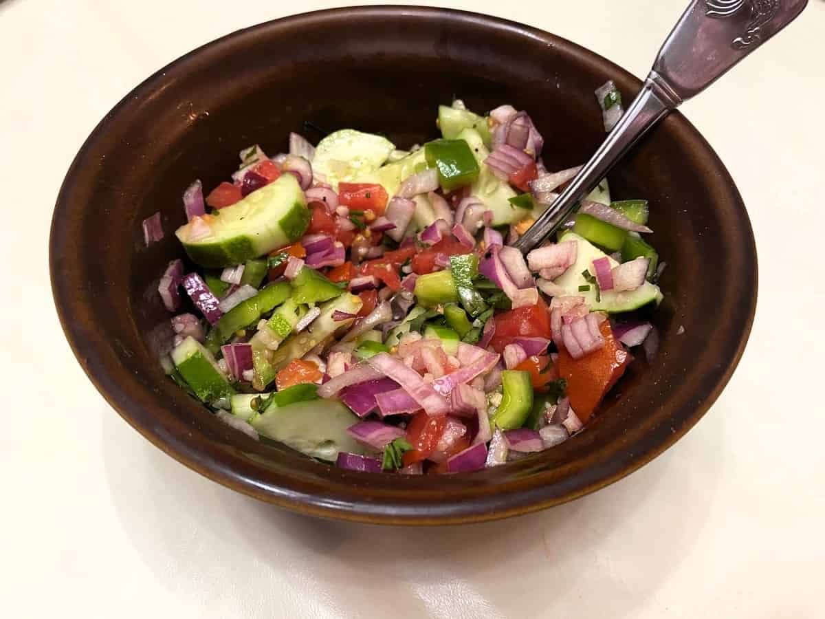 Serving Cucumber Salad in a vintage Marcrest USA Daisy Dot Brown Bowl