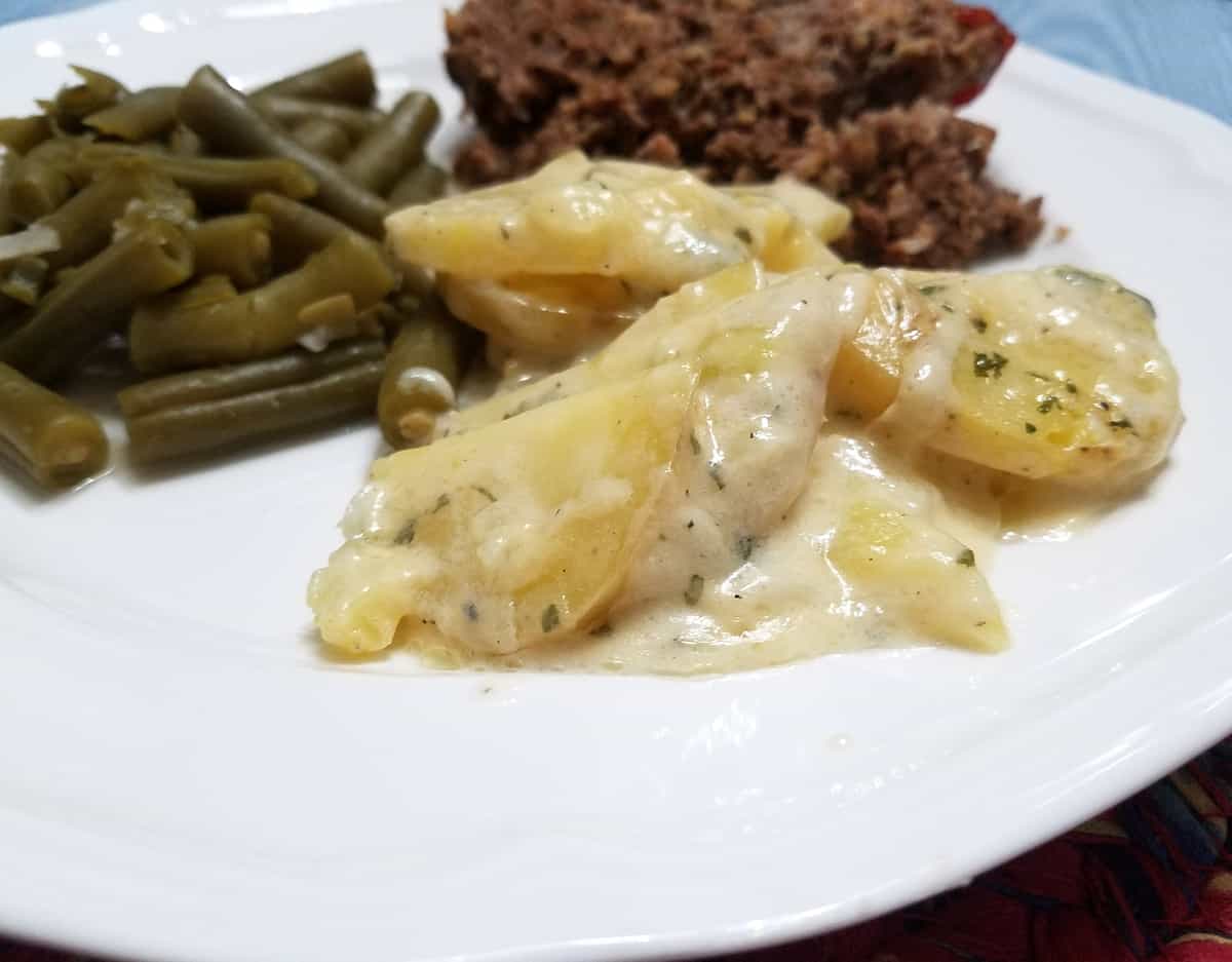 Serving Scalloped Potatoes with Sunday Meatloaf and Green Beans