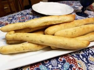 Serving Breadsticks for an Italian Dinner