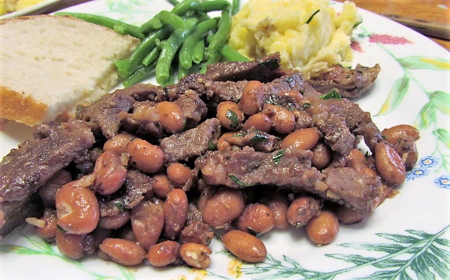 Serving Steak and Beans with Mashed Potatoes and Green Beans