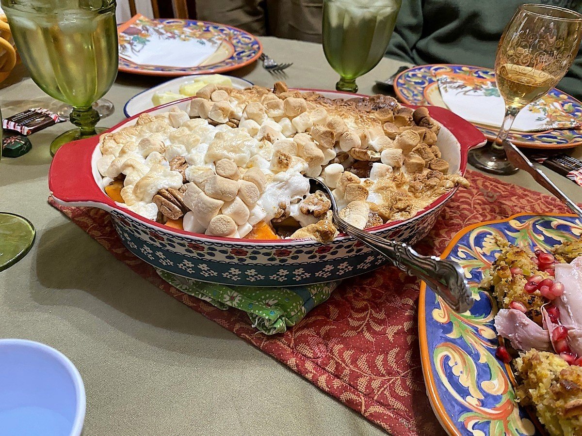 Serving Candied Sweet Potatoes at a Holiday Dinner