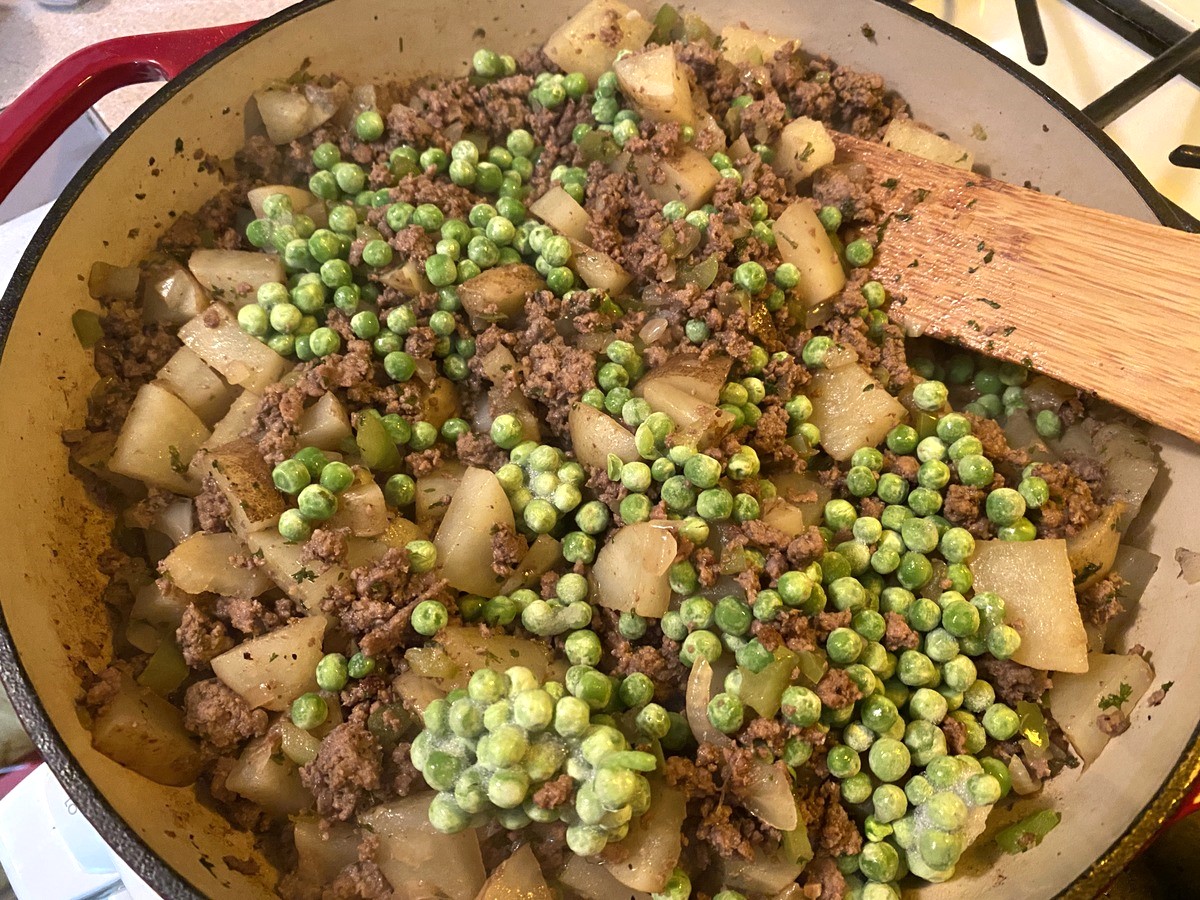 Adding Frozen Peas to the Dish