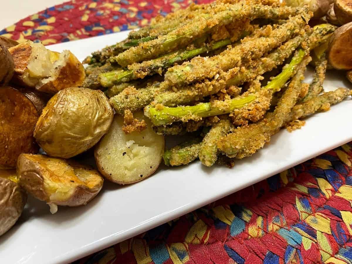 Serving Baked Asparagus Spears with Fried New Potatoes