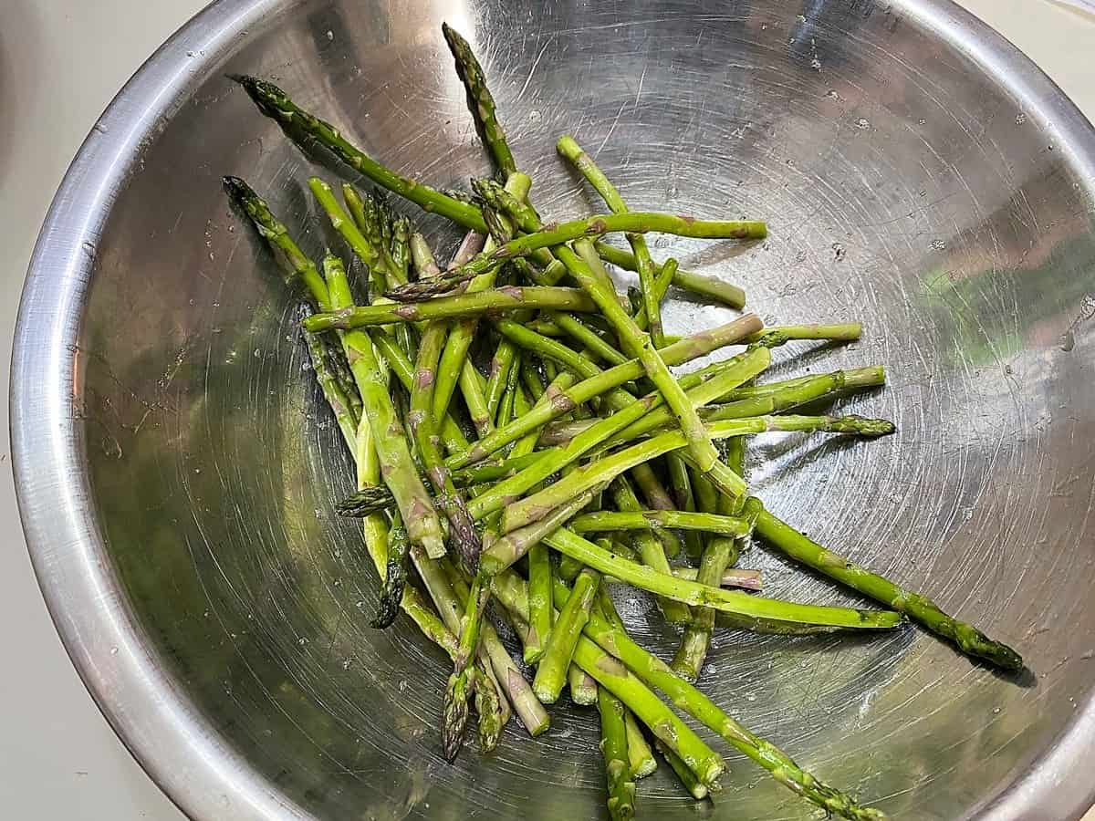 Place Fresh Asparagus Spears in a Large Bowl