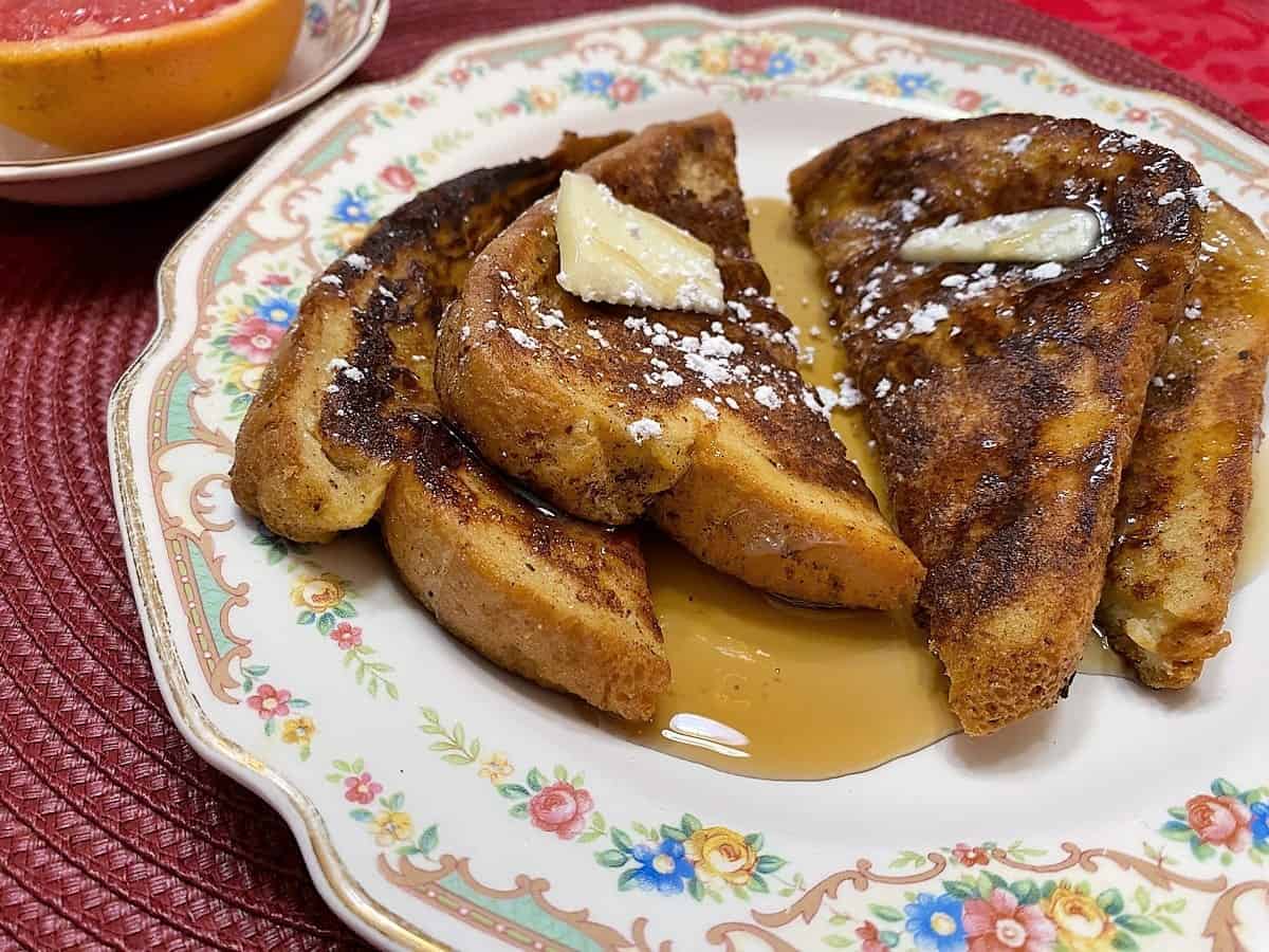 Serve French Toast with Butter, Syrup and Fresh Fruit.