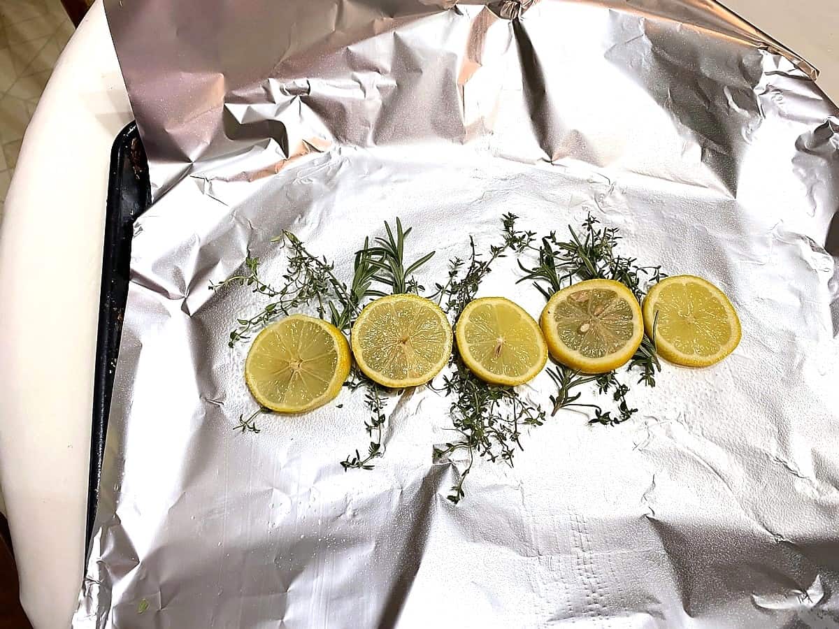 Place Fresh Herbs and Sliced Lemons Down Middle of Foil