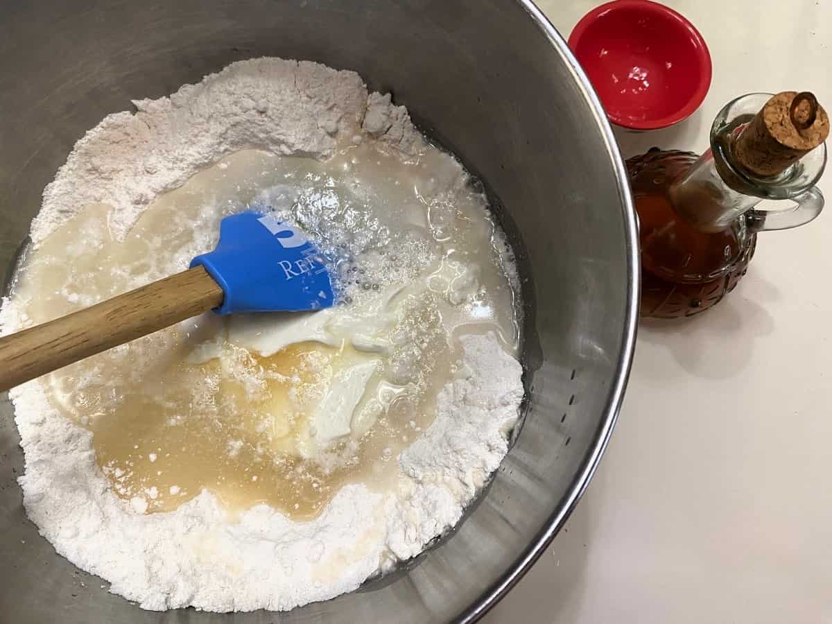 Add Water, Sour Cream, Oil, and Vanilla Extract to the Dry Ingredients