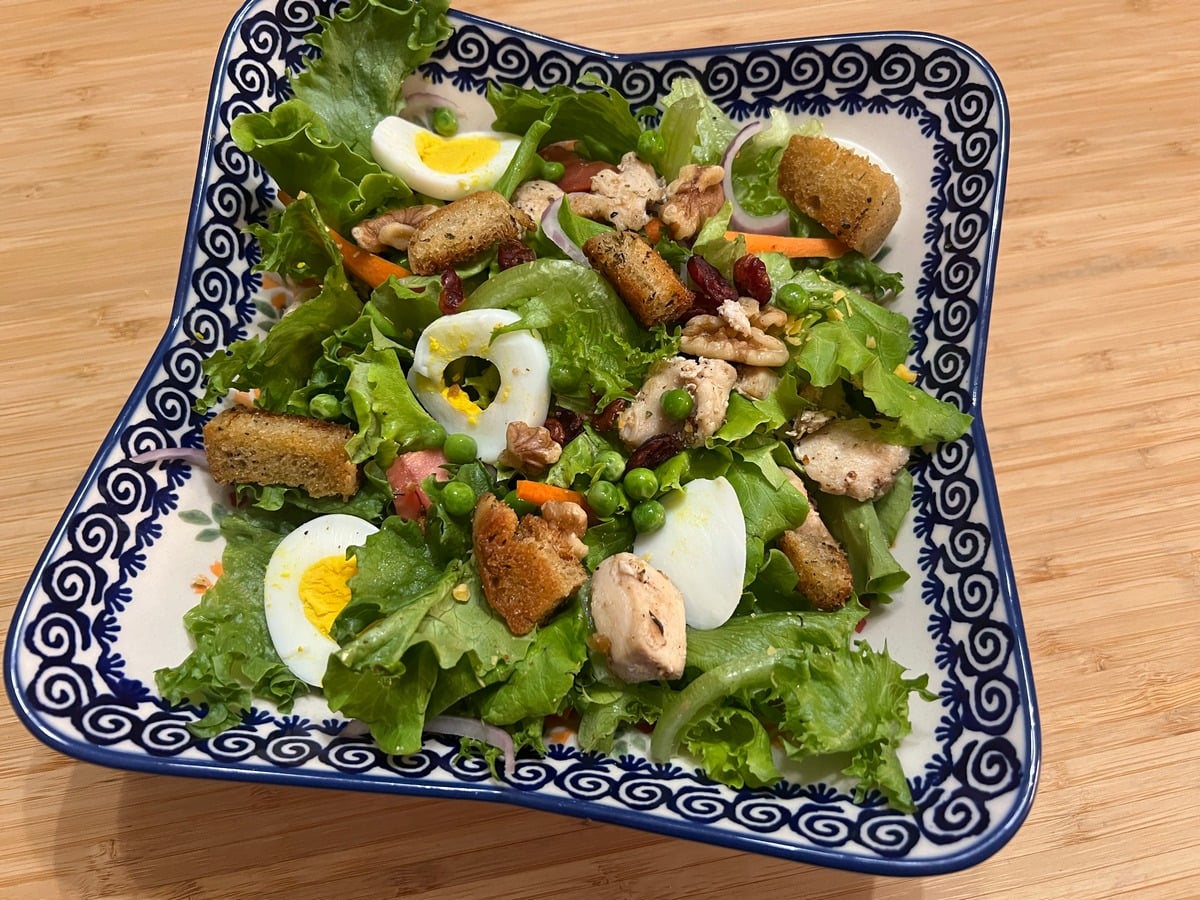 Add the Chicken, Sliced Eggs, and Croutons to the Salad