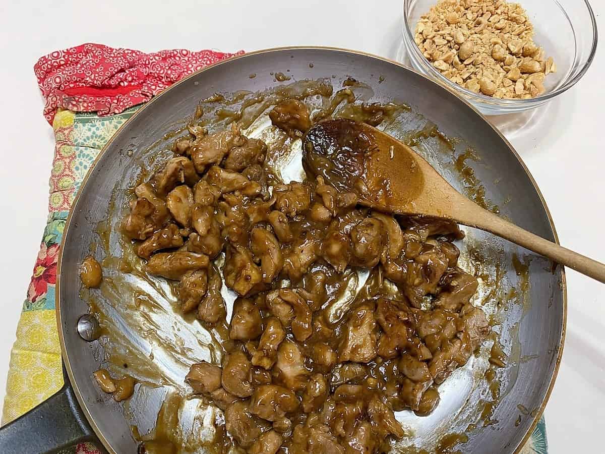 Place Chicken in a Serving Bowl and Sprinkle with Chopped Peanuts
