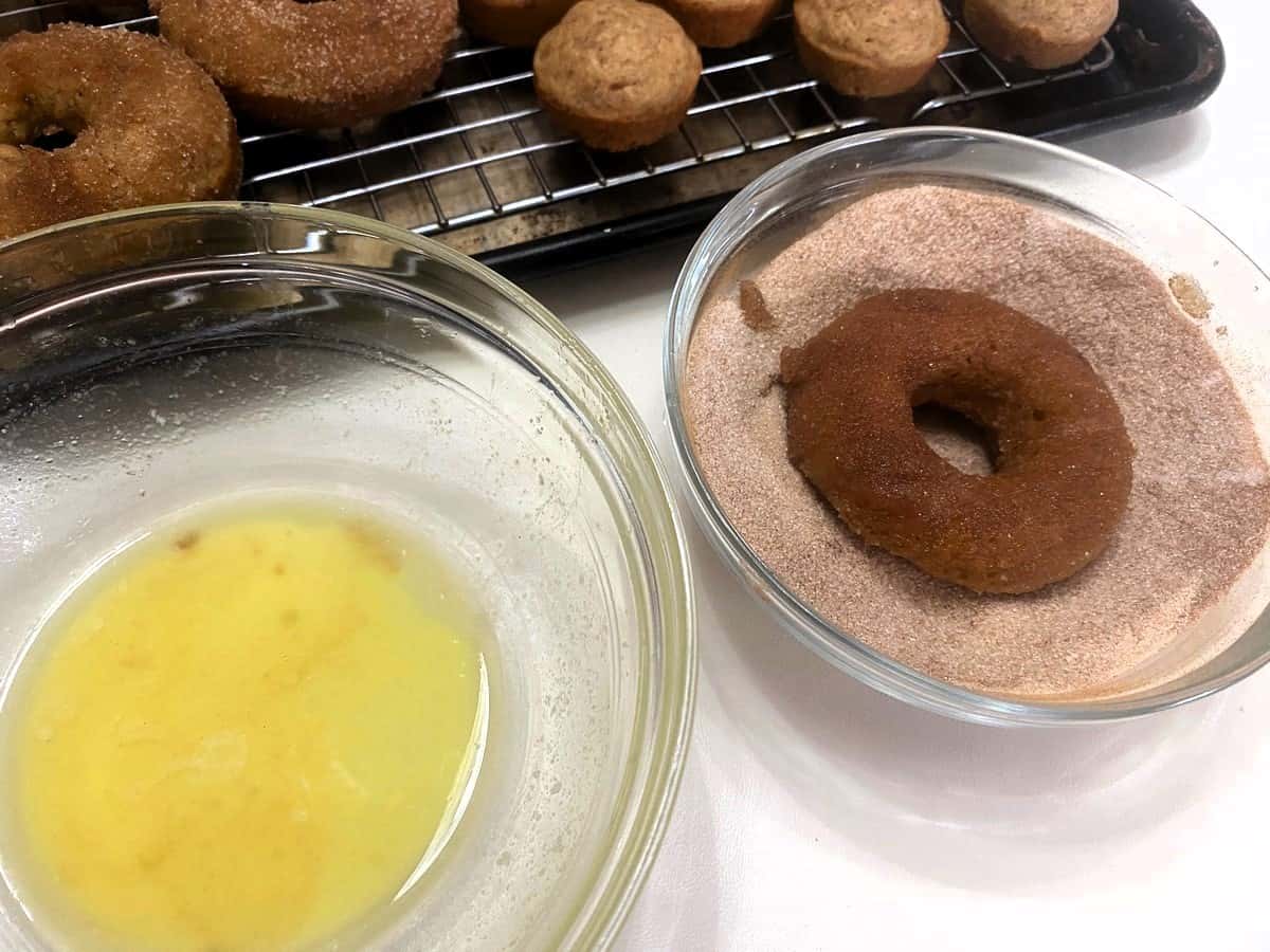 Dredge Buttered Donuts in Cinnamon Sugar Mixture
