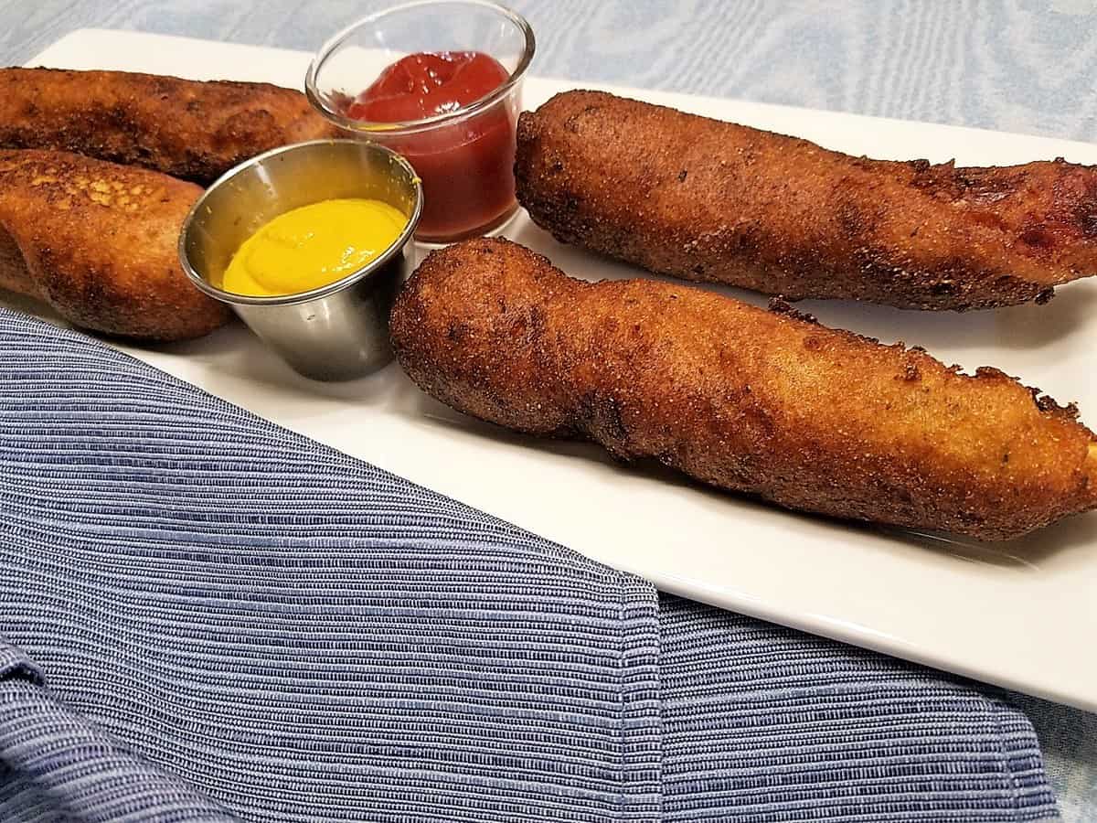 Serving Corn Dogs with Mustard and Ketchup