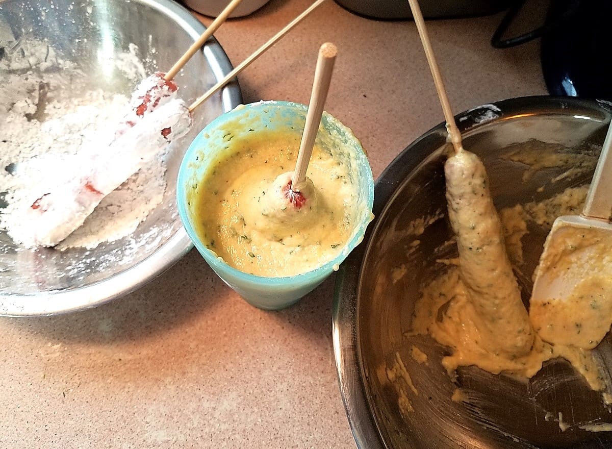 Dipping Beef Franks into the Cornmeal Batter