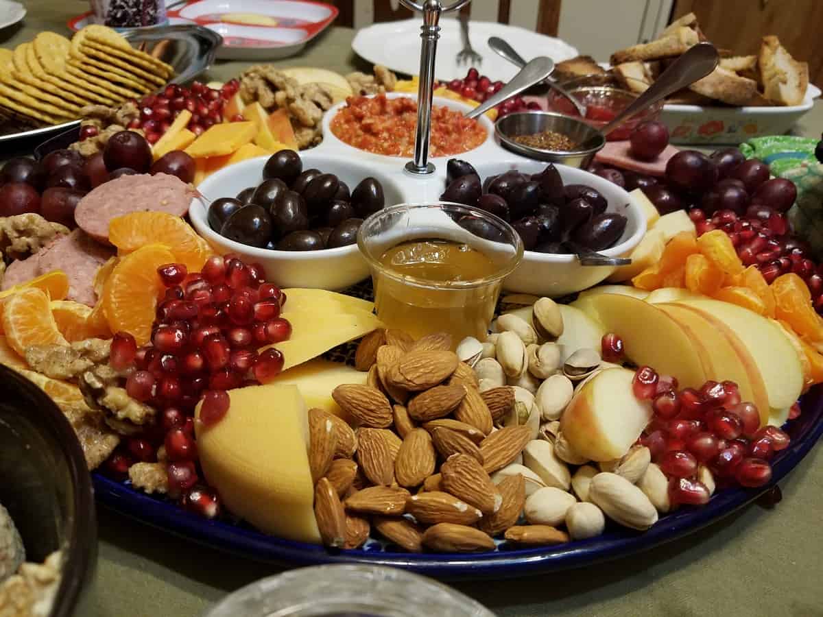 Serve Charcuterie Board with Nuts, Fruit, Cheese, and Sauces