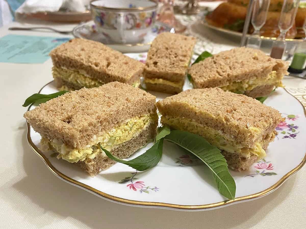 Garnishing Curried Chicken Sandwiches with Fresh Mint