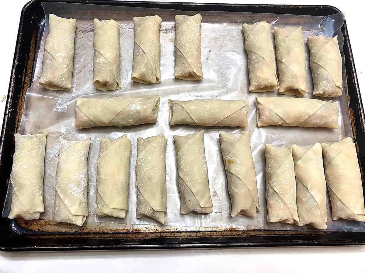 Place Egg Rolls on a Baking Sheet Lined with Waxed Paper
