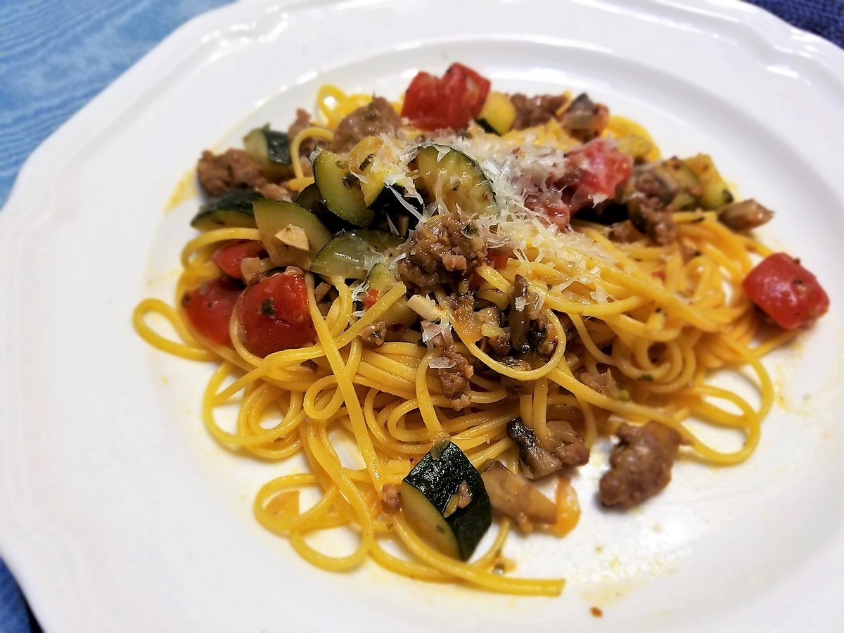 Serving Tagliolini with Vegetables and Sausage