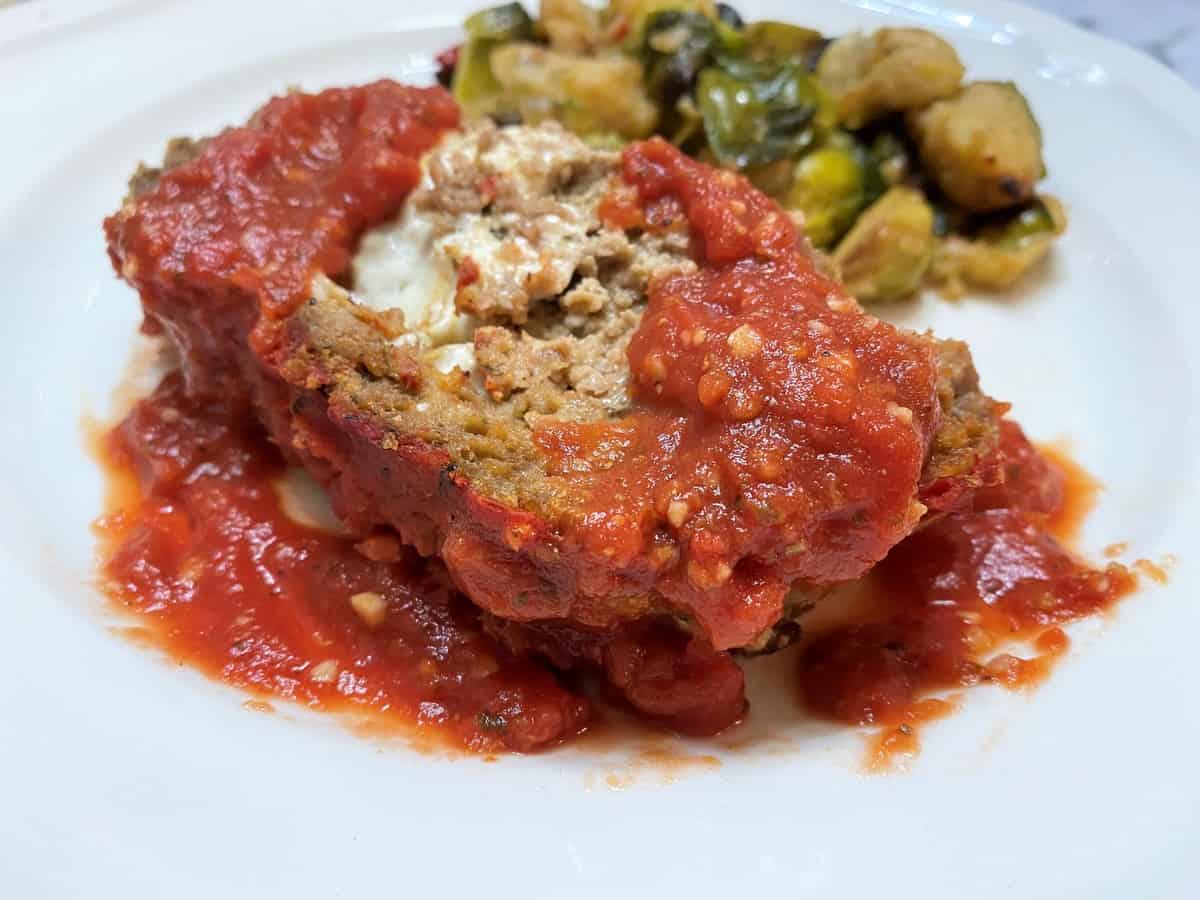 Serving Italian Meatloaf with Homemade Marinara Sauce