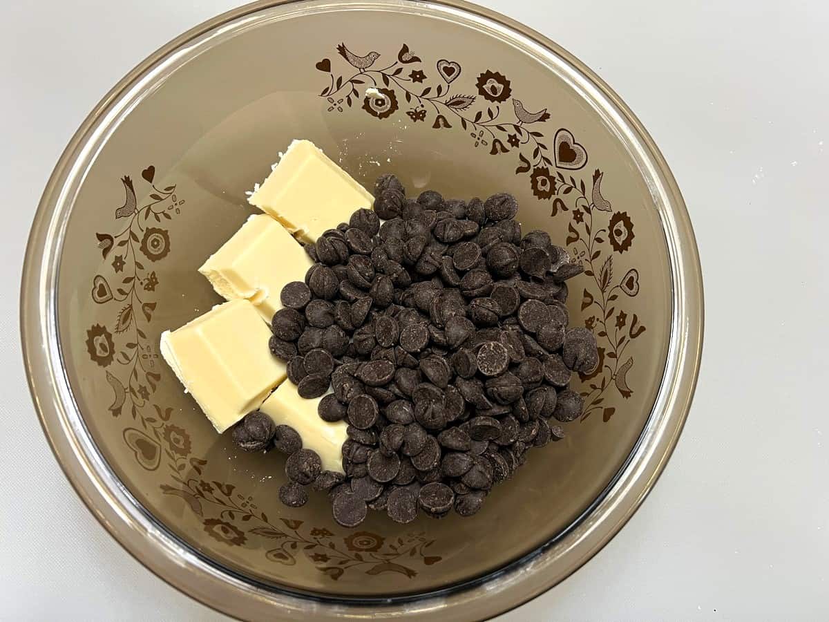 Melt Chocolate Pieces and White Almond Bark in Microwave-Safe Bowl