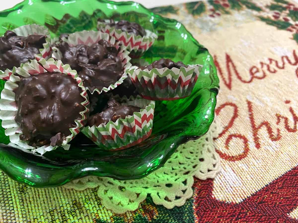Serving Macadamia Chocolate Clusters in Candy Wrappers in a Pretty Green Dish