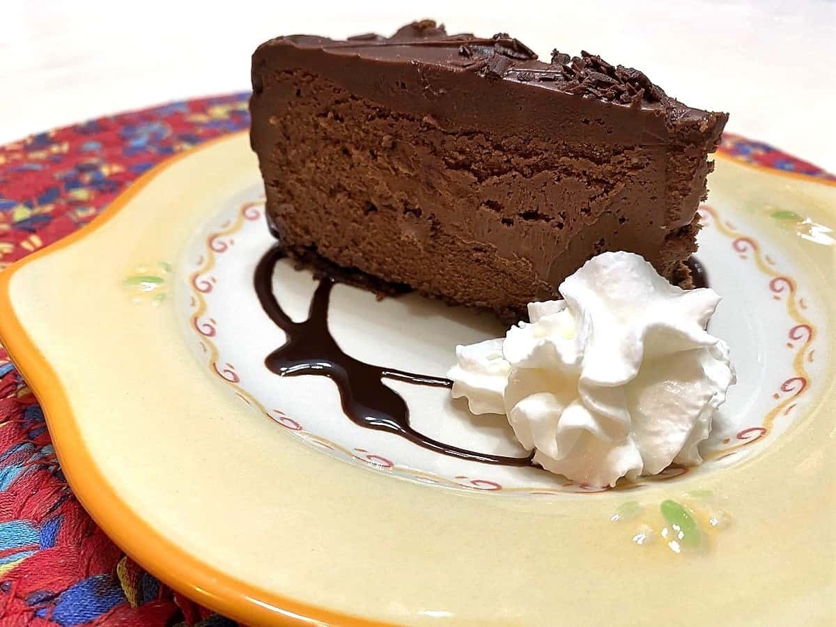 Serve Chocolate Fudge Cheesecake with Chocolate Syrup Swirls for Garnish