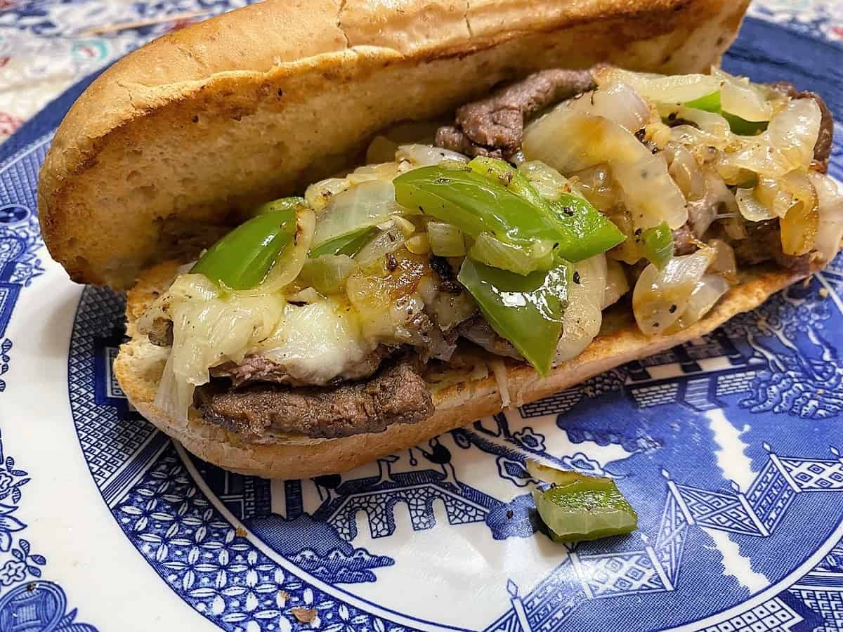 Place Steak and Toppings on a Browned Bun - Serve on Blue Willow Dinnerware