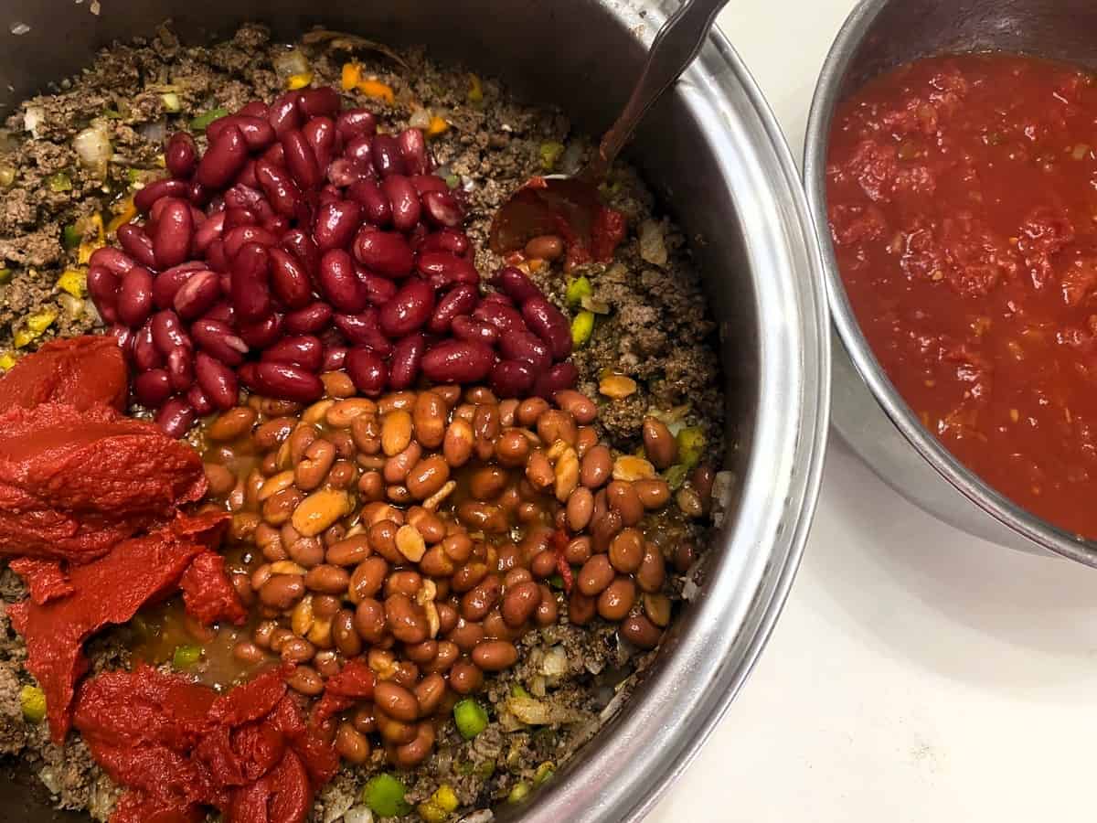 Add Beans and Tomatoes to the Chili