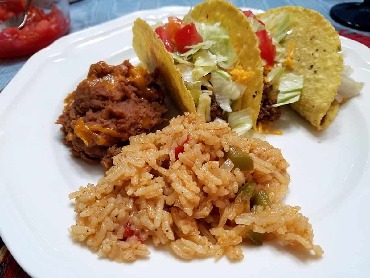 Serving Mexican Rice with Tacos