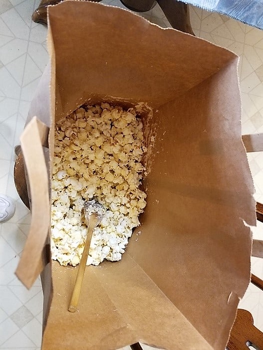 Mixing the Popcorn in a Paper Bag