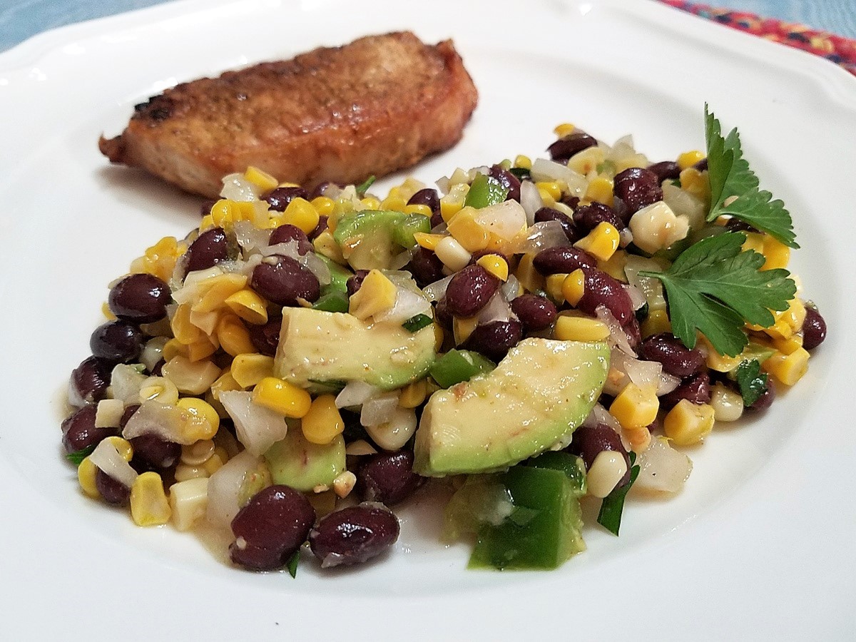 Serving Corn Salad with Grilled Pork Loin