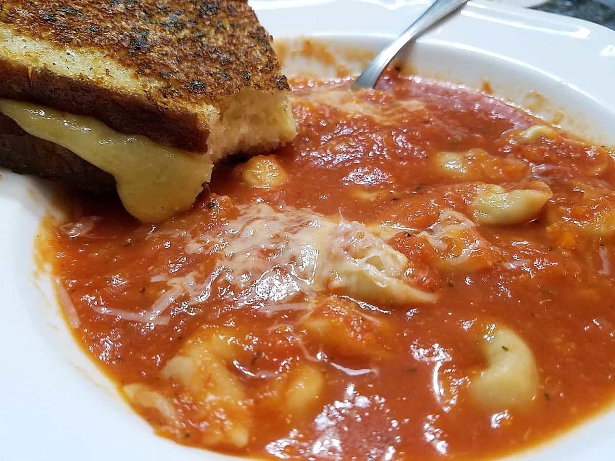 Serving Tomato Soup with Grilled Cheese Sandwiches