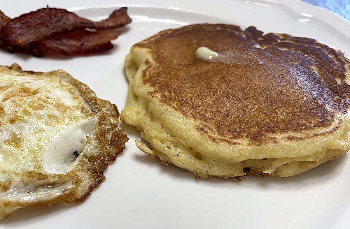 Serving Cornmeal Pancakes with Eggs and Bacon