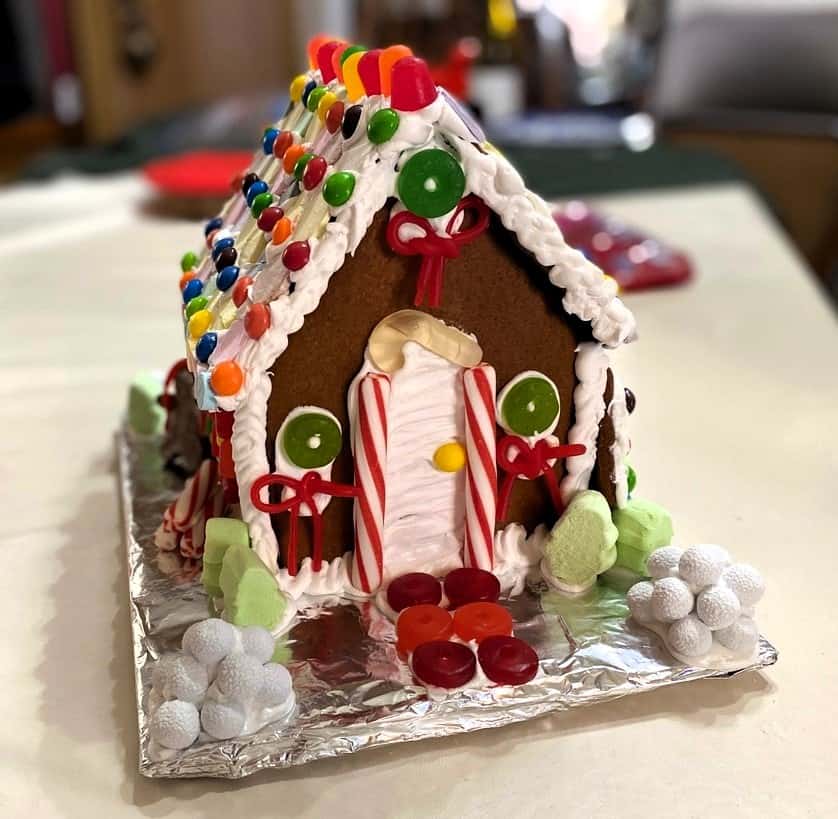 Place Gingerbread House on a Large Piece of Cardboard Covered with Aluminum Foil as a Base