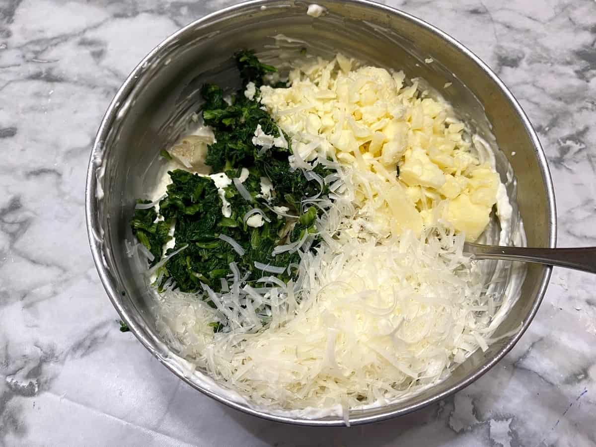 Stir in the Grated Cheese, Artichokes, and Spinach