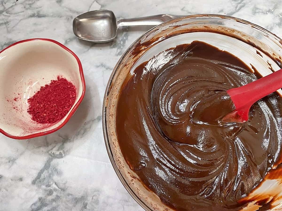 Adding the Freeze-Dried Raspberries to the Chocolate