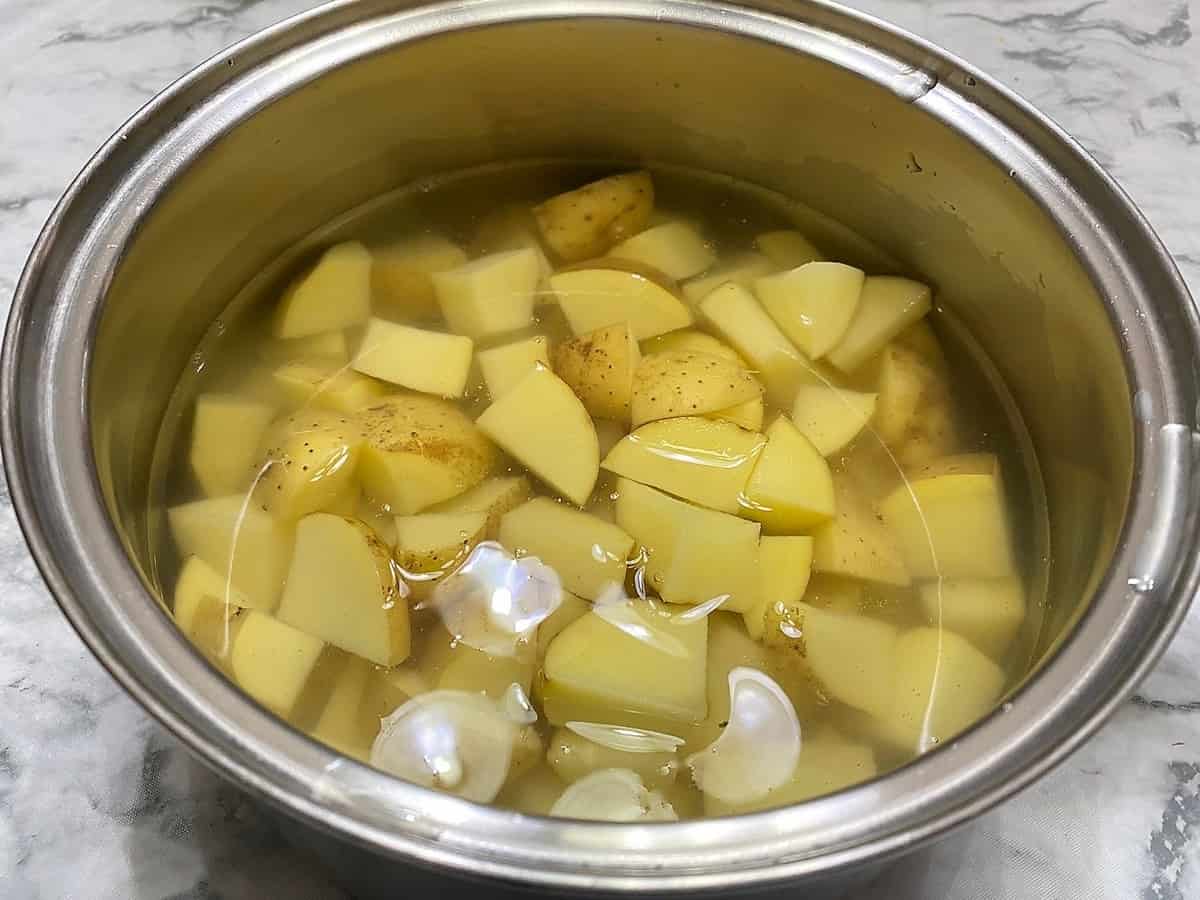 Cover Cubed Potatoes with Water to Boil