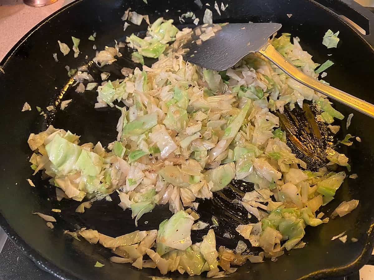 Saute Cabbage and Onion in Skillet with Butter and Bacon Grease
