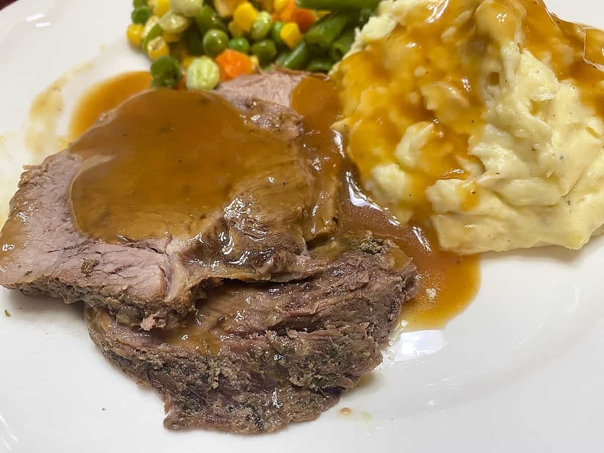 Serving Loin Tip Roast with Brown Gravy over Mashed Potatoes