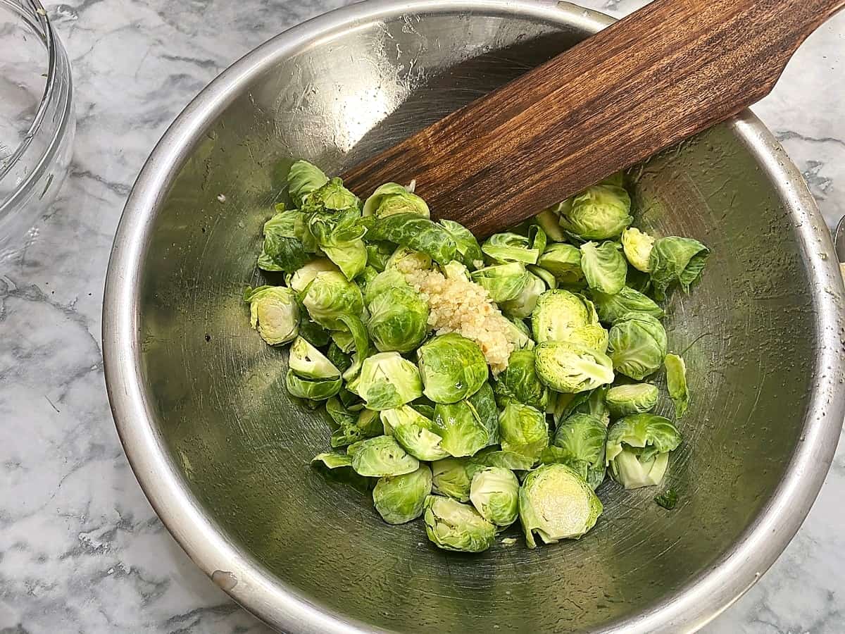 Add Garlic and Olive Oil to the Brussels Sprouts