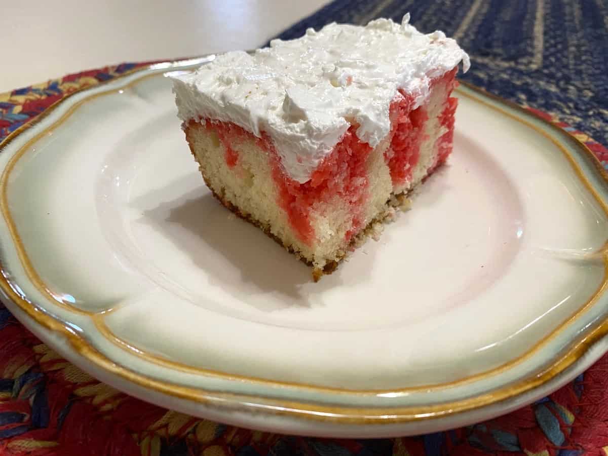 Serving Strawberry Poke Cake as a Summer Dessert
