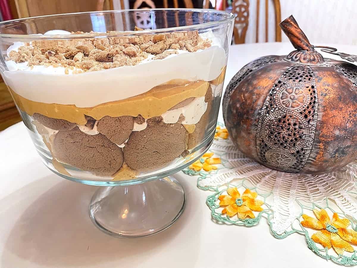 Serving Pumpkin Cheesecake Trifle with Gingersnaps in a Pretty Trifle Dish