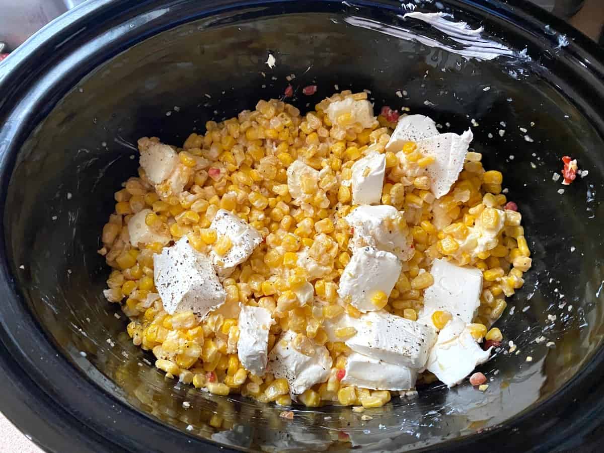 Add Pieces of Butter and Cream Cheese to the Corn