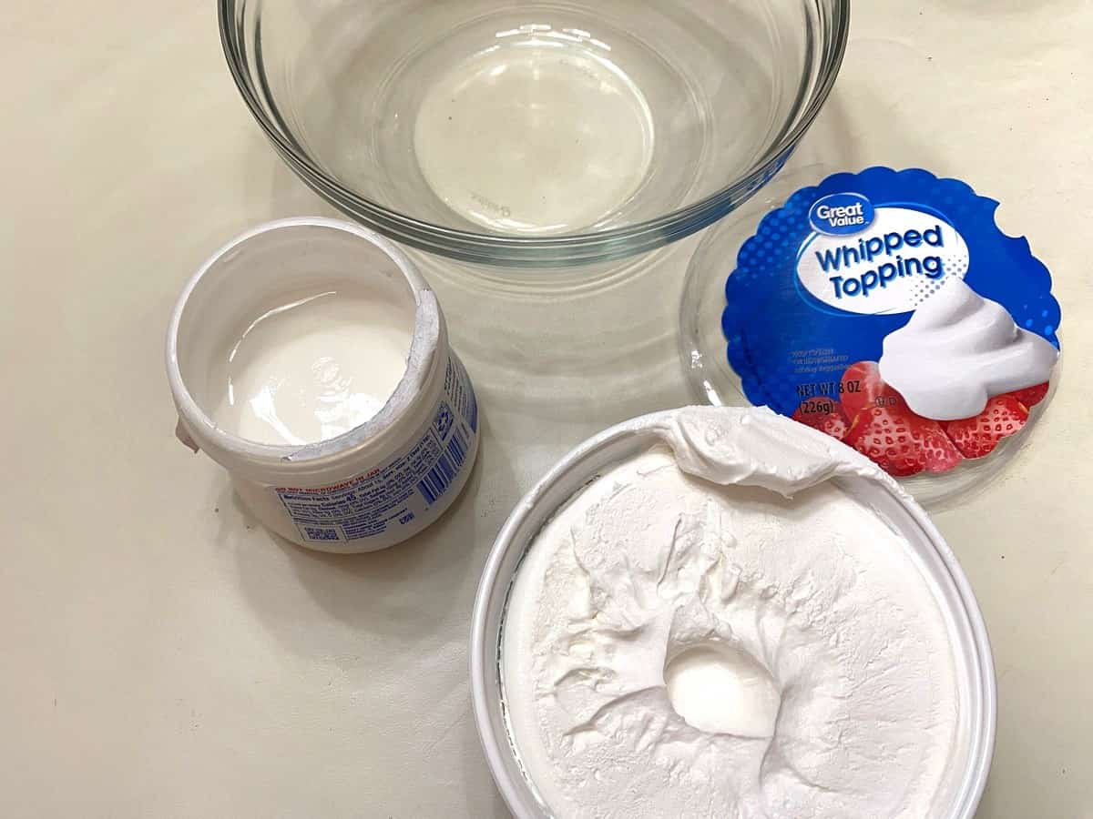 Combine Whipped Topping and Marshmallow Cream