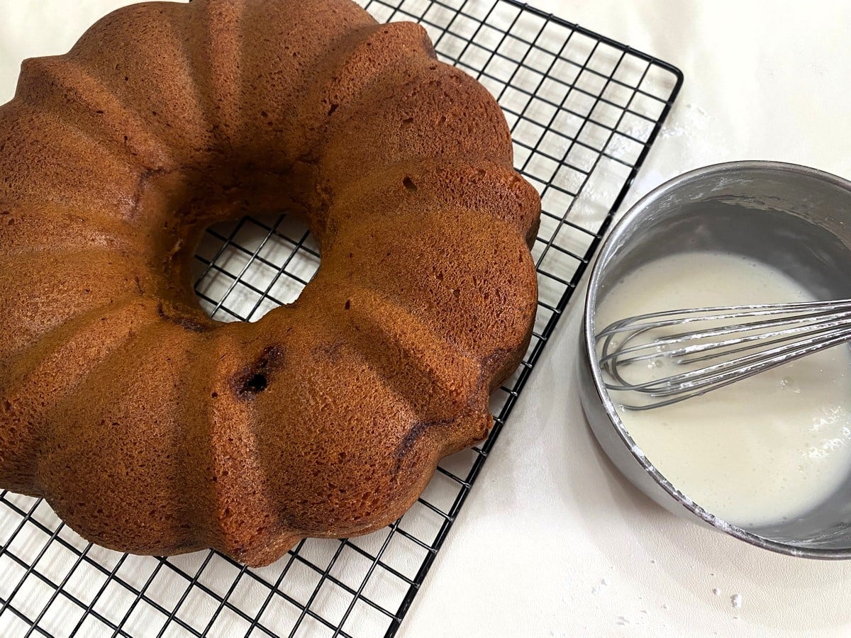 Drizzle Icing over Lightly Warm Cake