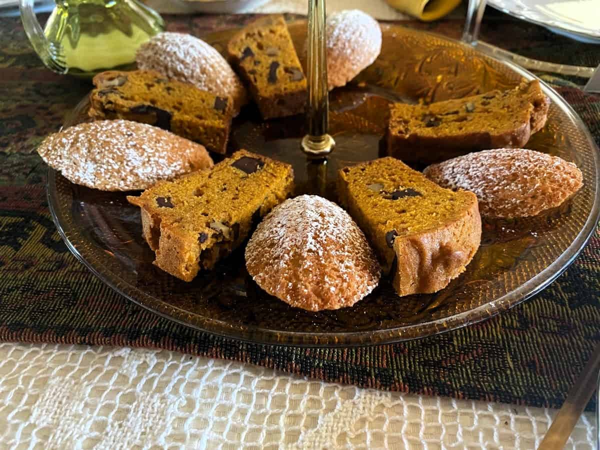 Madeleines with Powdered Sugar Garnish Served on a Tiered Tray